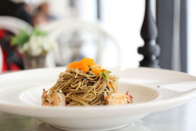 Close-up of noodles in bowl on table