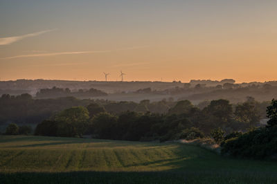 Scenic view of landscape against sky during sunset