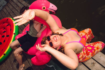 High angle view of young woman sitting on table