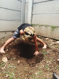 Full length of woman against wall