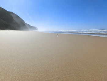 Scenic view of beach against sky