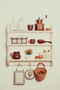 View of bottles on shelf against white background