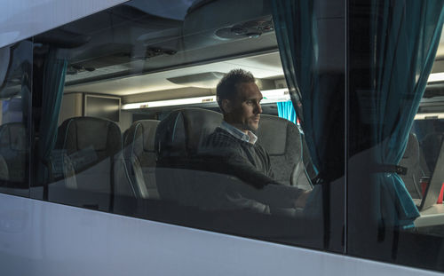 Man sitting in bus