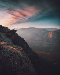 Scenic view of rocky mountains against sky during sunset