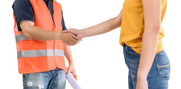 Midsection of man holding hands against white background
