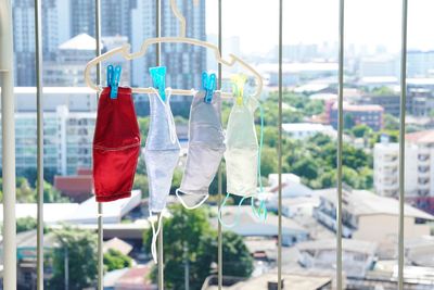 Close-up of clothes drying against window