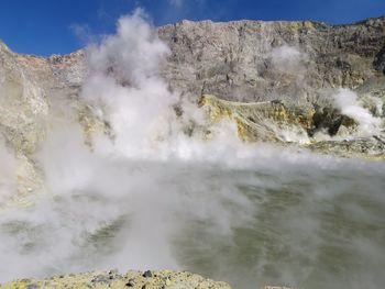 Smoke emitting from volcanic mountain