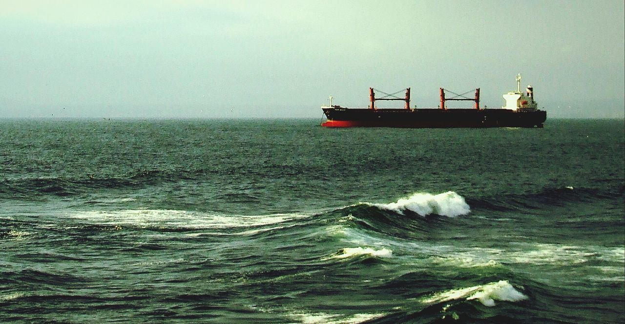 water, nautical vessel, transportation, mode of transport, sea, boat, waterfront, sailing, rippled, scenics, nature, beauty in nature, horizon over water, tranquility, travel, tranquil scene, clear sky, sky, copy space, outdoors