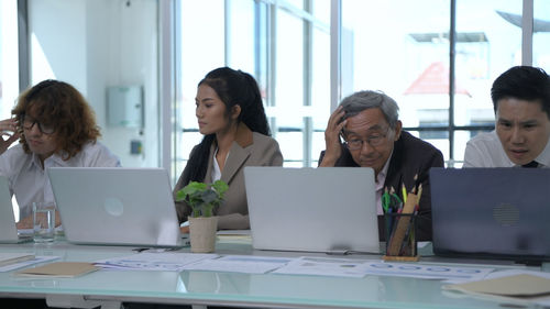 Group of people working on table