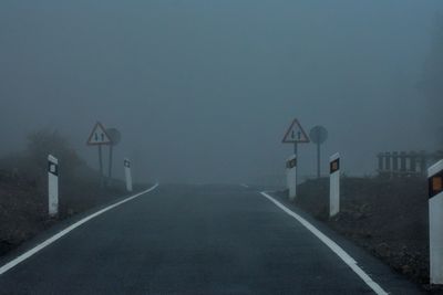 Road sign in foggy weather