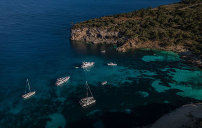 High angle view of sailboats in sea