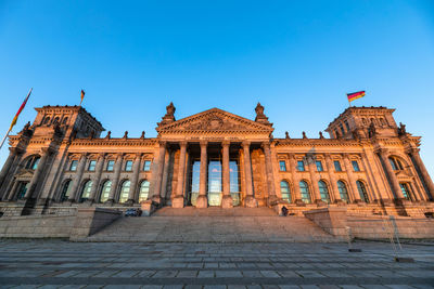 Facade of historic building against blue sky