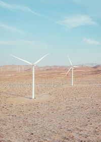 Windmill farm in california desert, vertical drone image