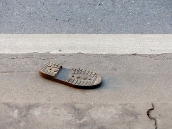 High angle view of abandoned shoes on street