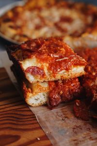 High angle view of pizza on cutting board