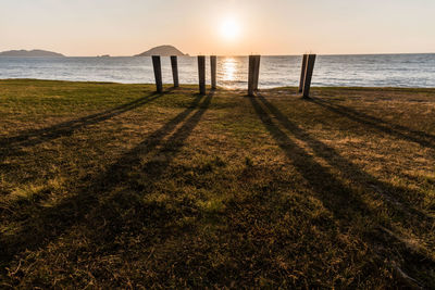 Scenic view of beach against sky during sunset