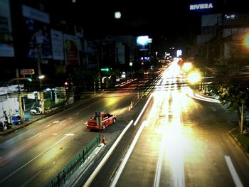 Traffic light trails on road at night