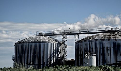 Silos against sky