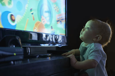 Boy looking at camera at home