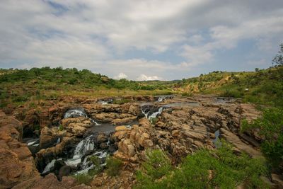 Scenic view of rocks against sky