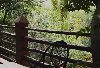 Close-up of bicycle wheel against trees