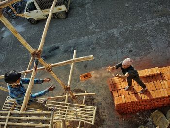 High angle view of people standing on road