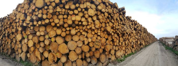 Stack of trunks against sky