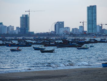 Buildings in city against sky