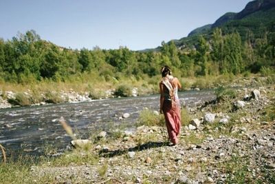 Full length of woman standing on landscape