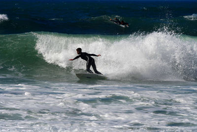 Man surfing in sea