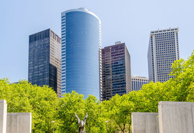 Low angle view of modern buildings against clear sky