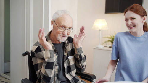 Smiling doctor talking with patient