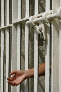 Close-up of the hand of a man in prison