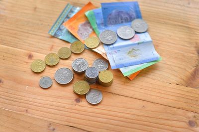 High angle view of coins on table