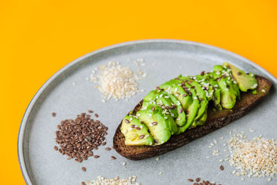 Ingredients for healthy avocado toast. sesame flax seeds. vegan keto diet. healthy eating. vegetaria