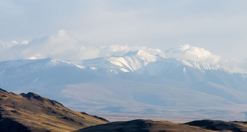 Scenic view of snowcapped mountains against sky