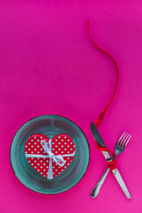 High angle view of pink art on table