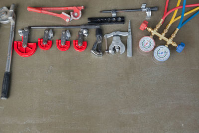 High angle view of work tools on table at workshop