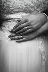 Close-up of couple touching hands