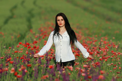 Young woman standing on field