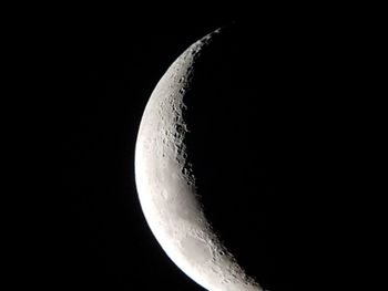 Low angle view of moon against sky at night