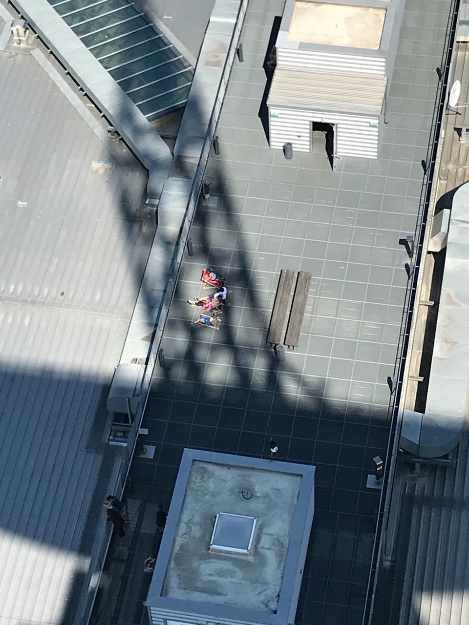 HIGH ANGLE VIEW OF PEOPLE WALKING ON BUILDING