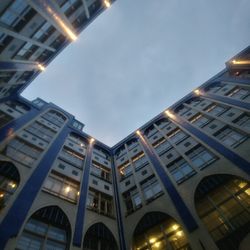Low angle view of illuminated buildings against sky