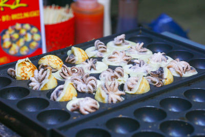 Takoyaki being prepared in ho thi ky street food, ho chi minh city