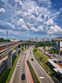 High angle view of traffic on road against cloudy sky