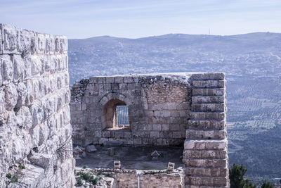 Old building against mountain range