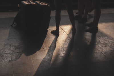 Low section of people on tiled floor