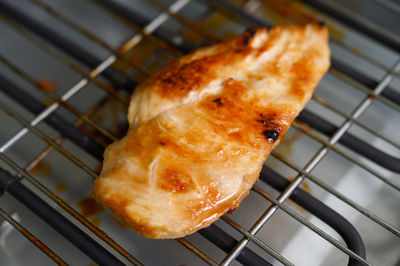 High angle view of meat on barbecue grill