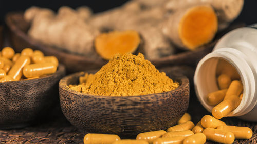 Close-up of yellow eggs in container