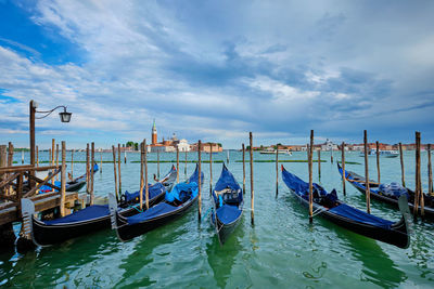 Boats moored in canal